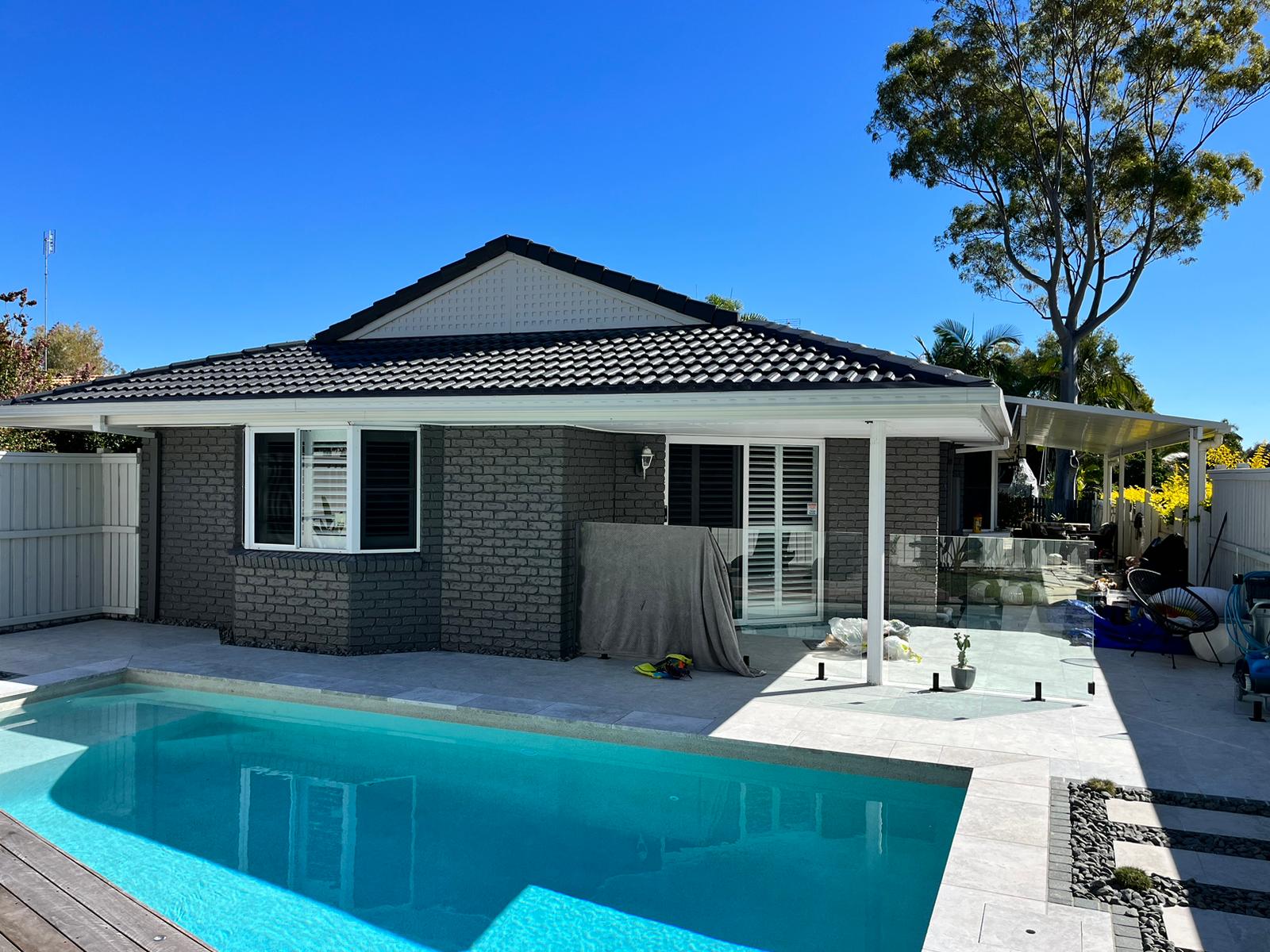 Freshly painted Sunshine Coast home beside a swimming pool